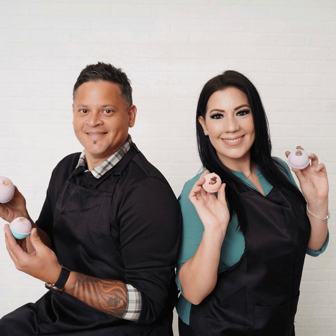 Our story Handmade soap business in Fort Worth Texas featuring two smiling artisans holding colorful handmade soaps