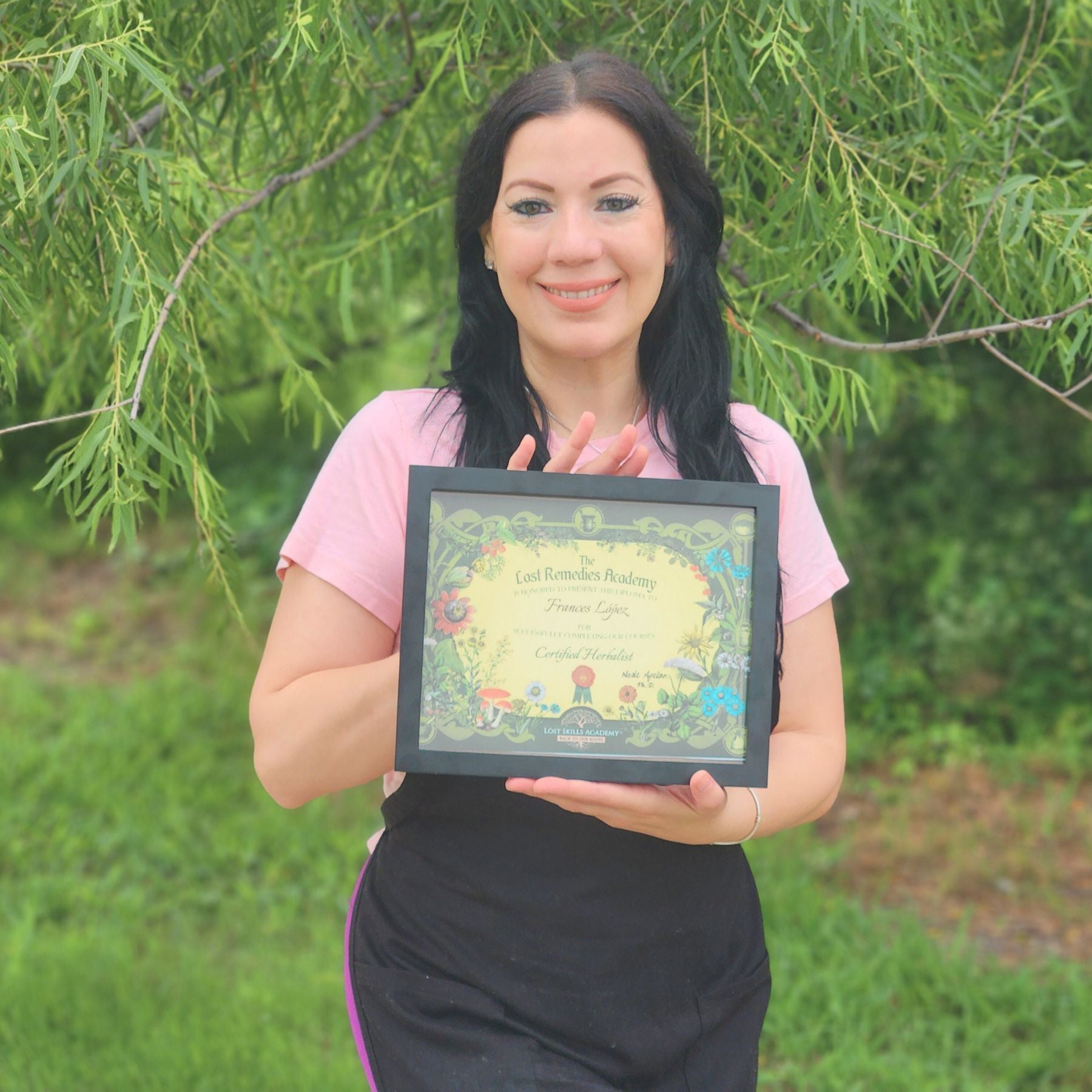 certified herbalist in fort worth texas holding her diploma