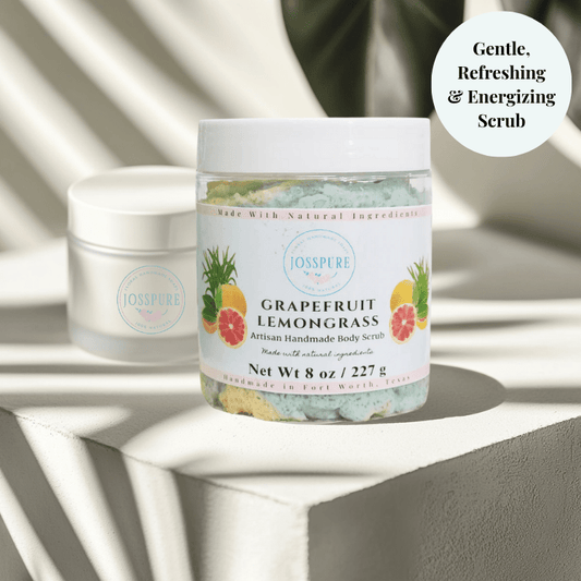 JOSSPURE grapefruit lemongrass luxury sugar scrub in clear jar with white lid on textured surface