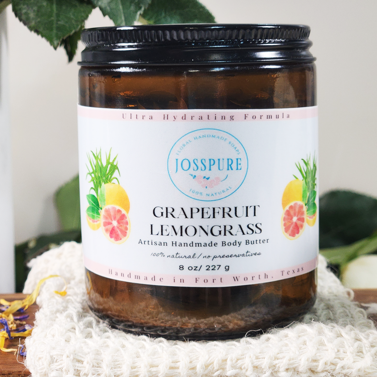 JOSSPURE grapefruit orange mango butter whipped body butter in a brown jar with white label and fruit illustrations